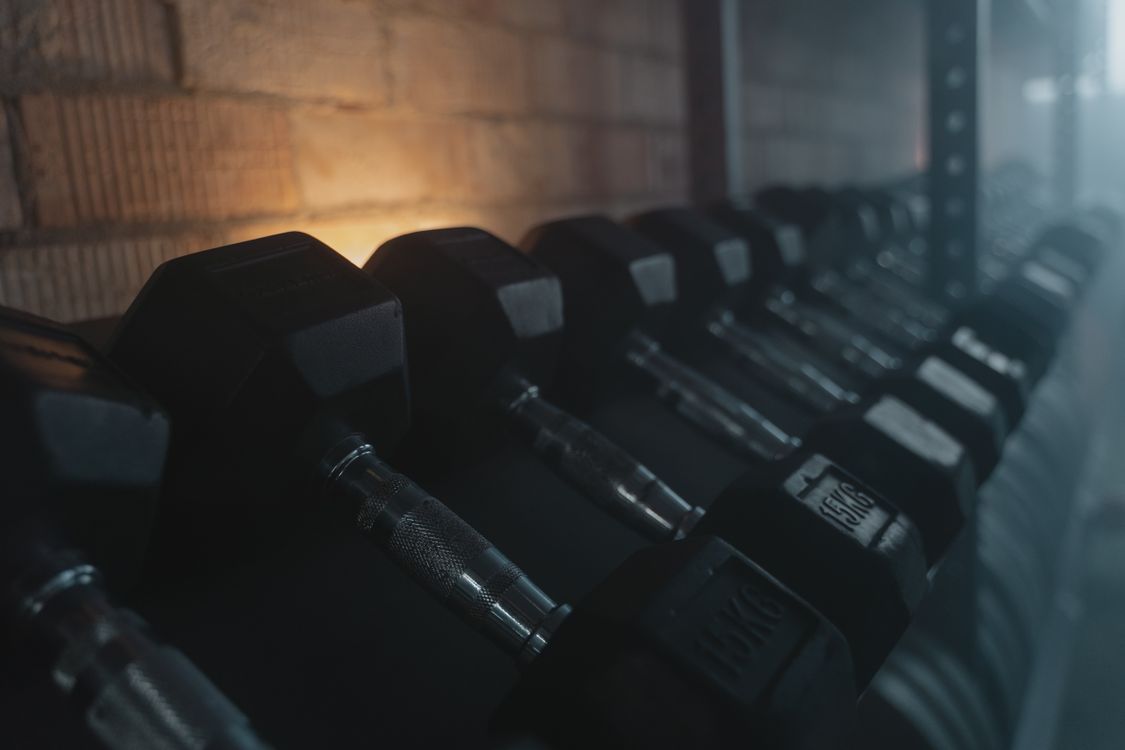 Illustrative close-up of dumbbells on a rack